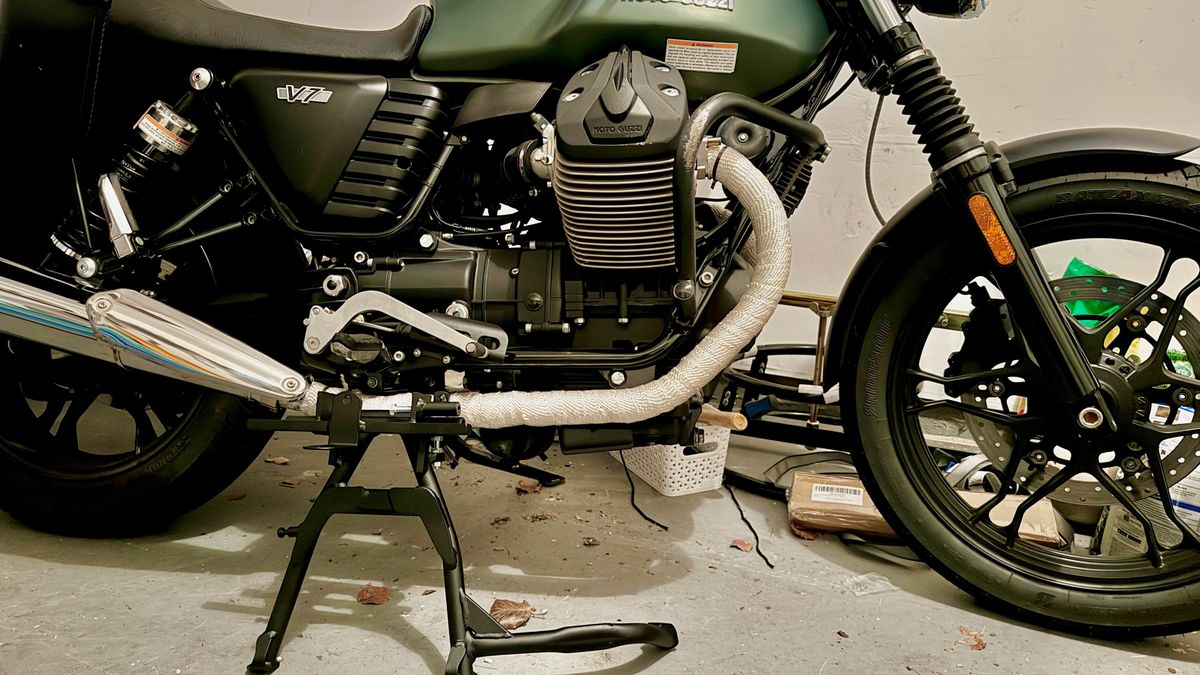 A centerstand leaning against a MotoGuzzi motorcycle